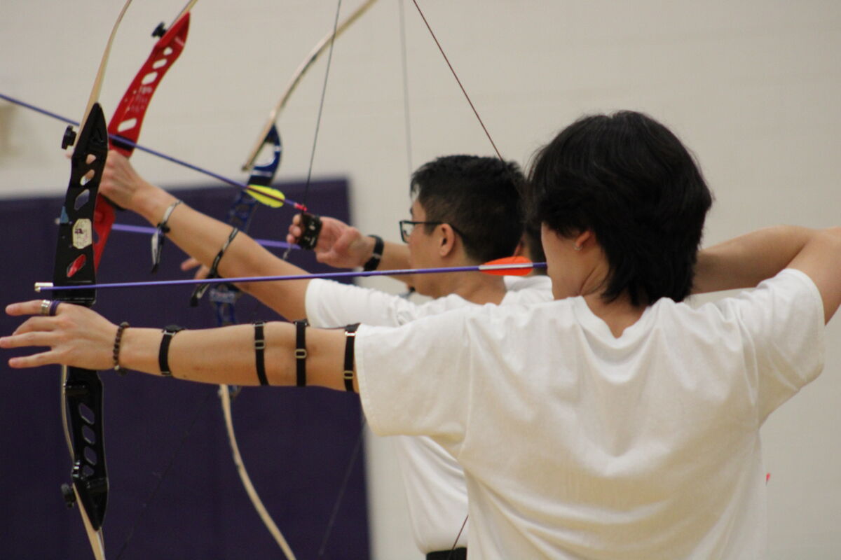 Two archers on the shooting line
